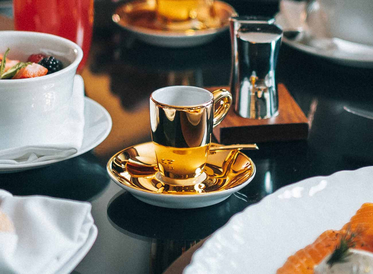 Difference Coffee served in a gold cup