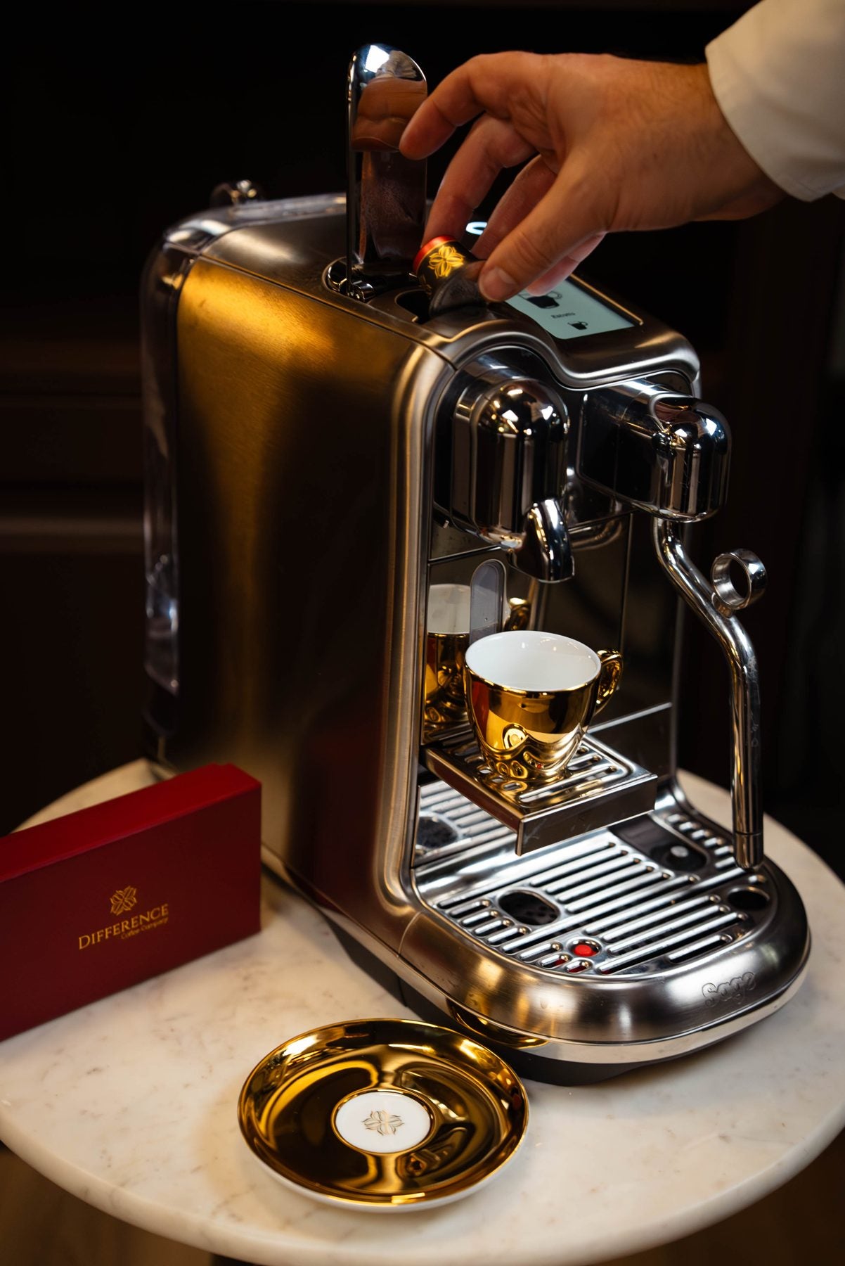 Difference capsule beside a Nespresso machine