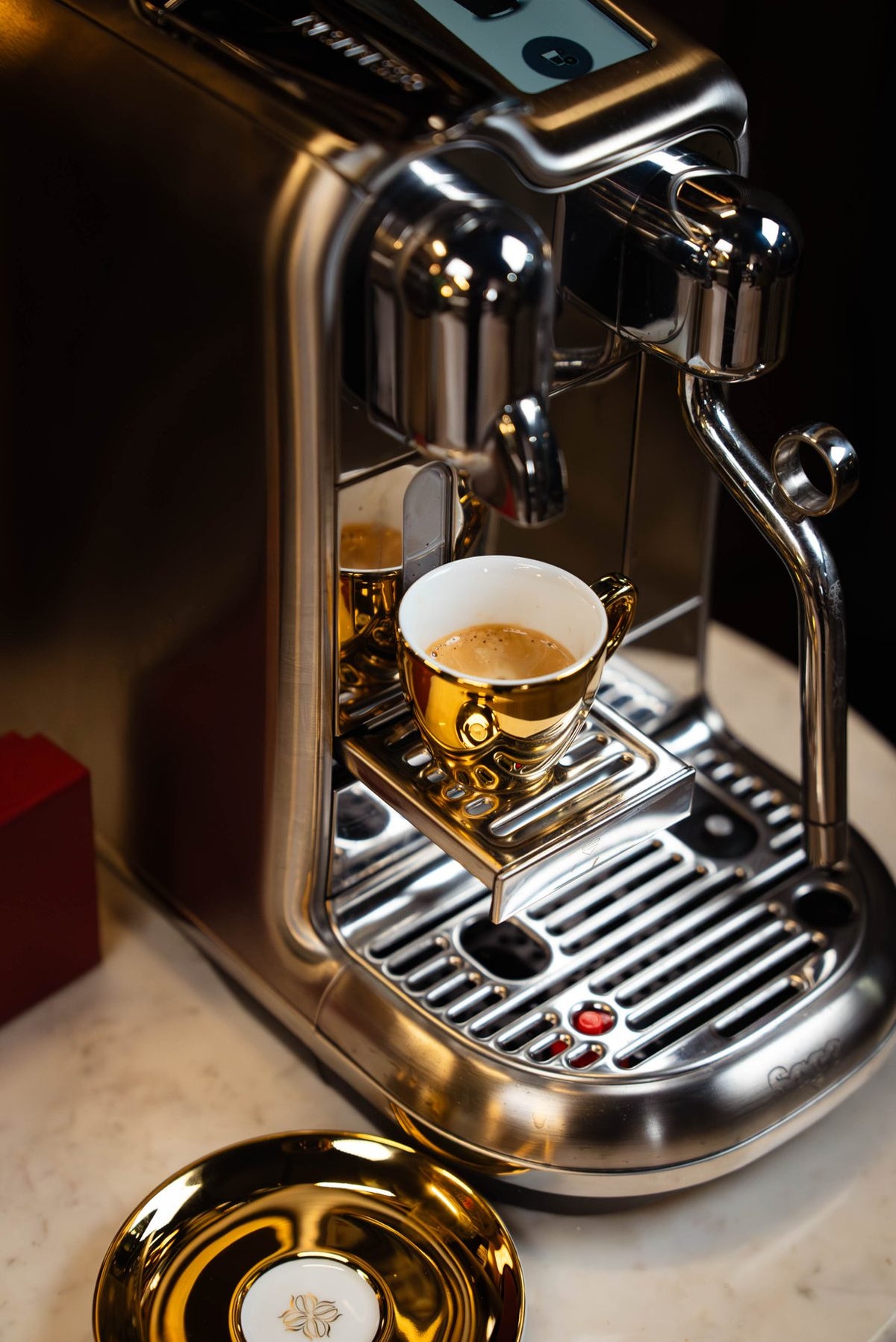 Finished espresso in a gold cup