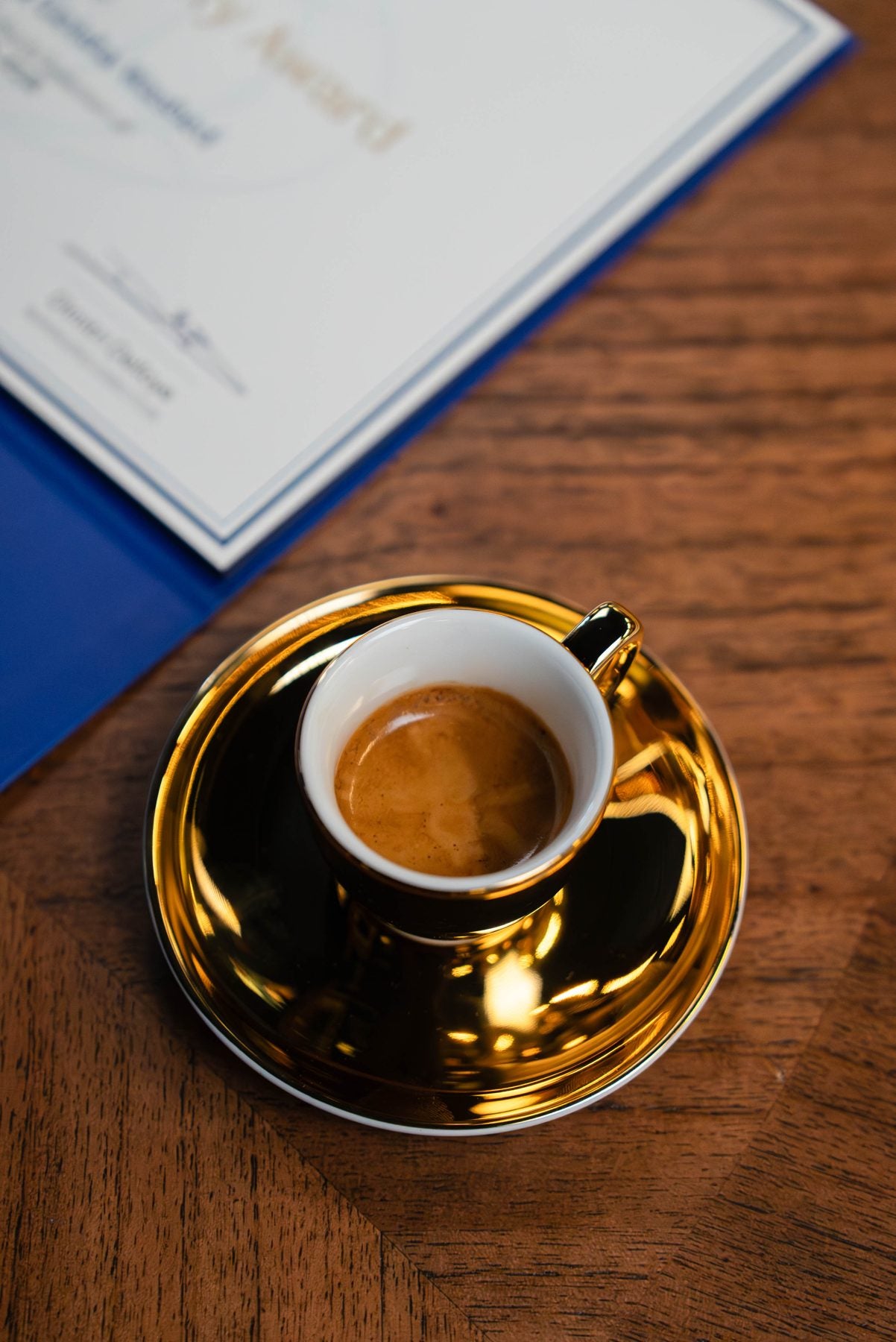 Espresso in a gold cup, seen from above